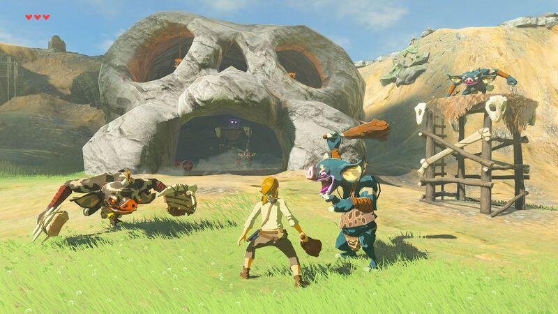 Herói enfrentando dois monstros em frente a uma caverna com forma semelhante de caveira.